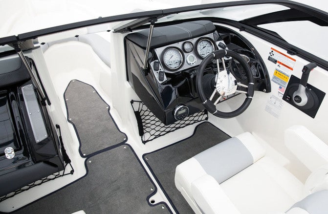 The helm console boasts a European design, centered around an attractive and comfortable chrome-on-black double-spoked steering wheel. 