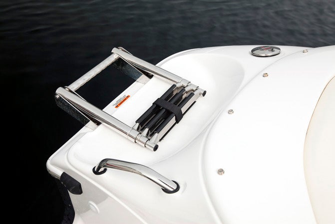 A retracting three-step boarding ladder and stainless courtesy handle are appreciates by swimmers and skiers alike.