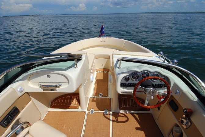 Both the passenger and helm console provide ample protection from the wind and plenty of secure storage.