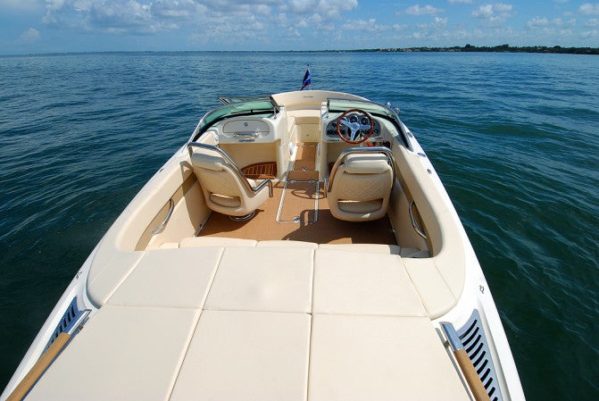 A large sunpad over the engine hatch provides the ideal place to stretch out after a swim.