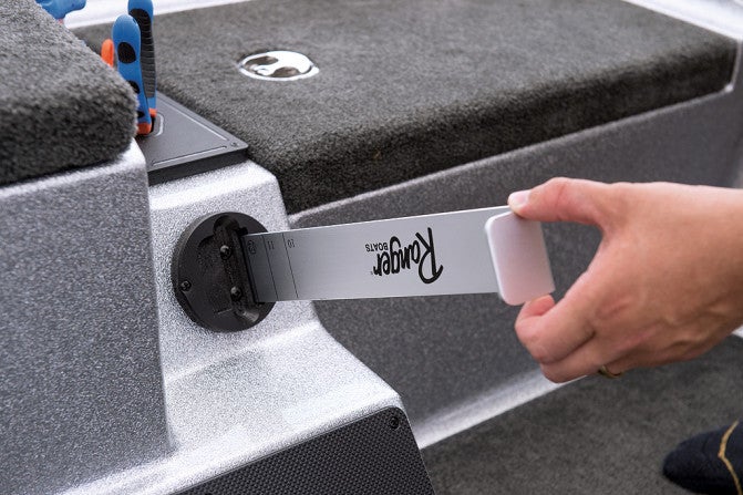 An integral storage slot for a bumper board makes it quick and convenient to check that fish meet minimum size limits.